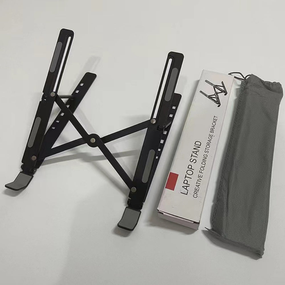 Black laptop stand next to its retail box and gray carry pouch