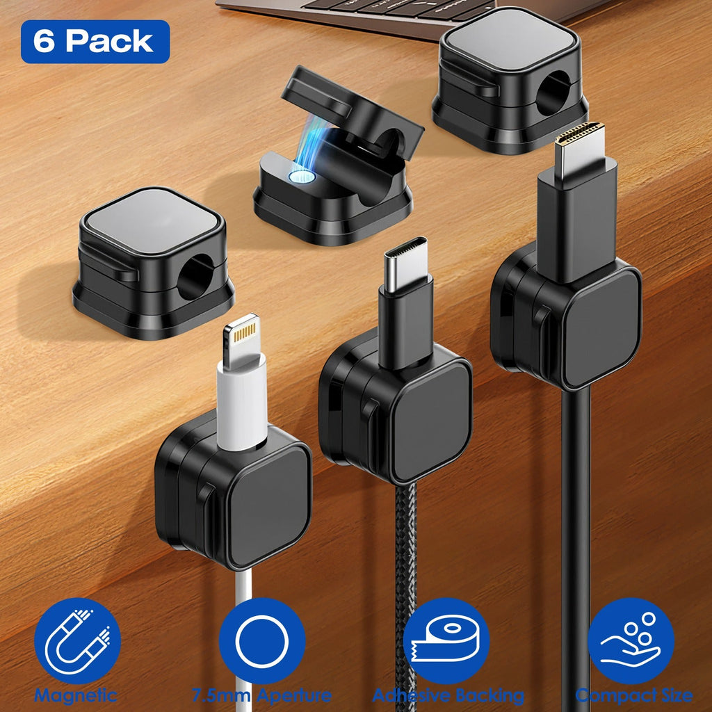 Six black magnetic cable clips holding charging cables on a desk