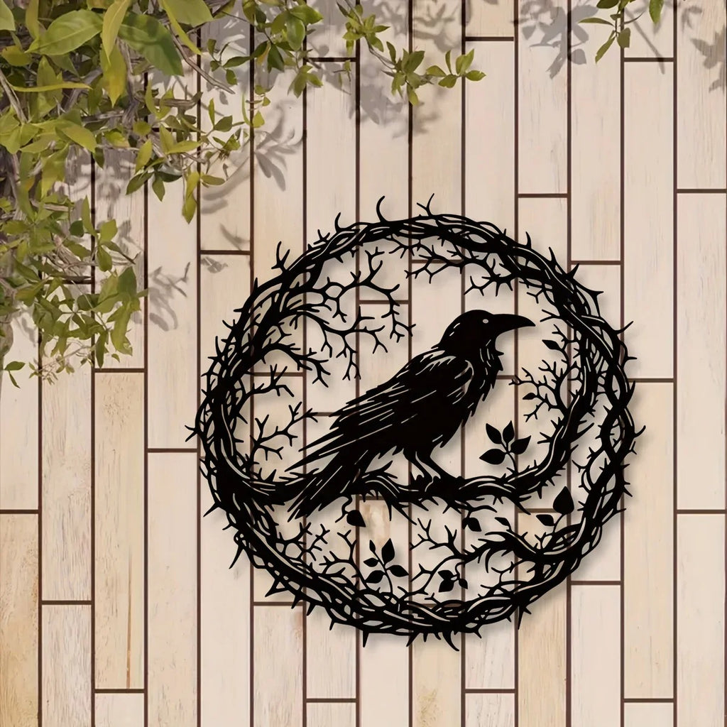 Round crow wall art on a wooden fence