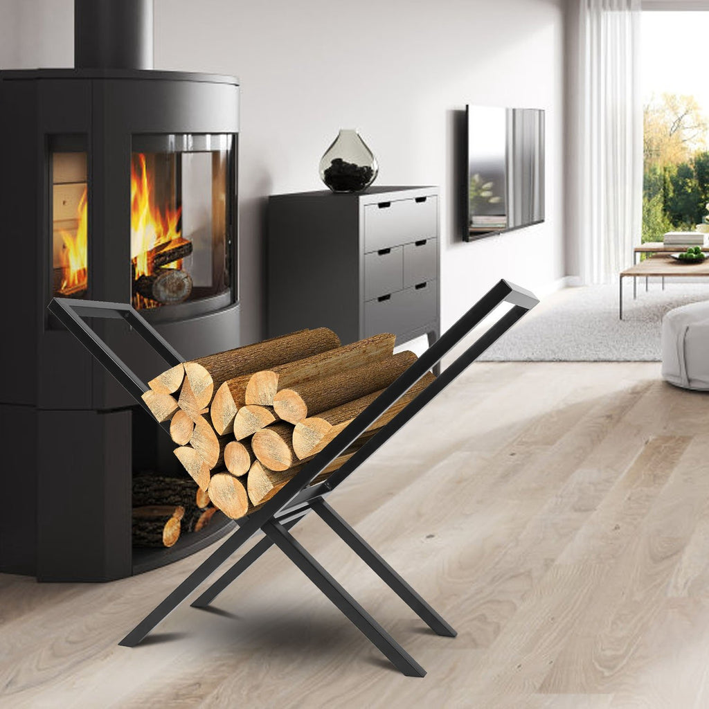 Black steel firewood rack holding logs beside a black wood stove in a living room