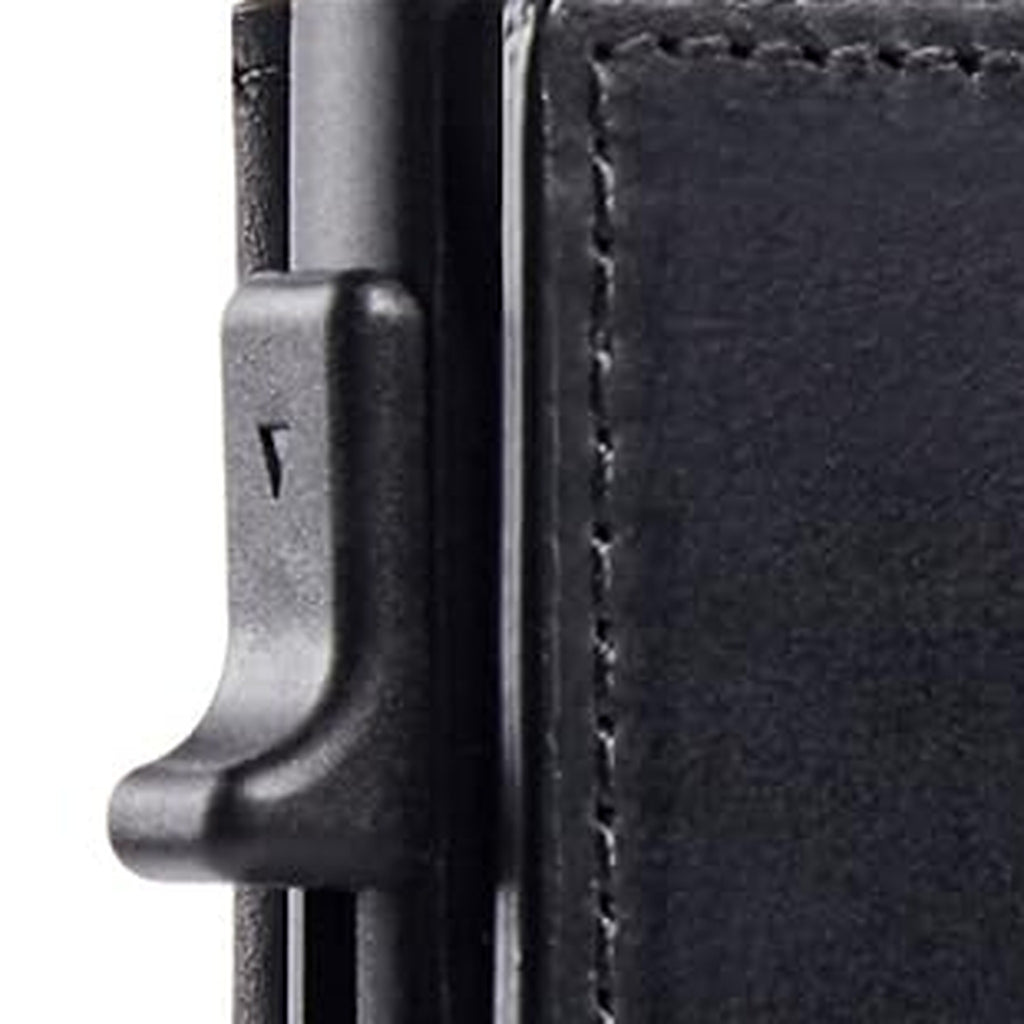Side view of the slim wallet's metal card holder and pop-up card trigger