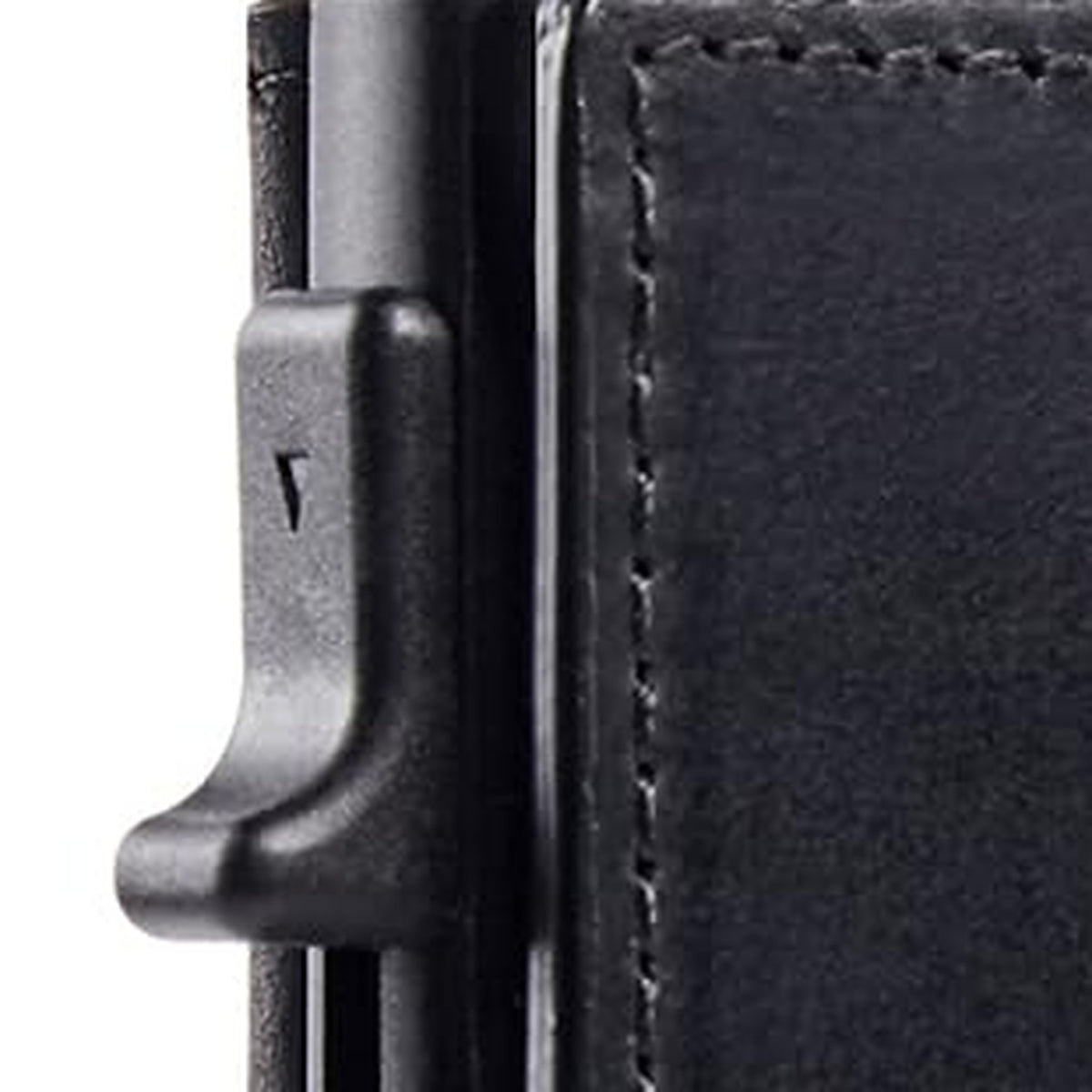 Side view of the slim wallet's metal card holder and pop-up card trigger