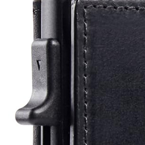 Side view of the slim wallet's metal card holder and pop-up card trigger