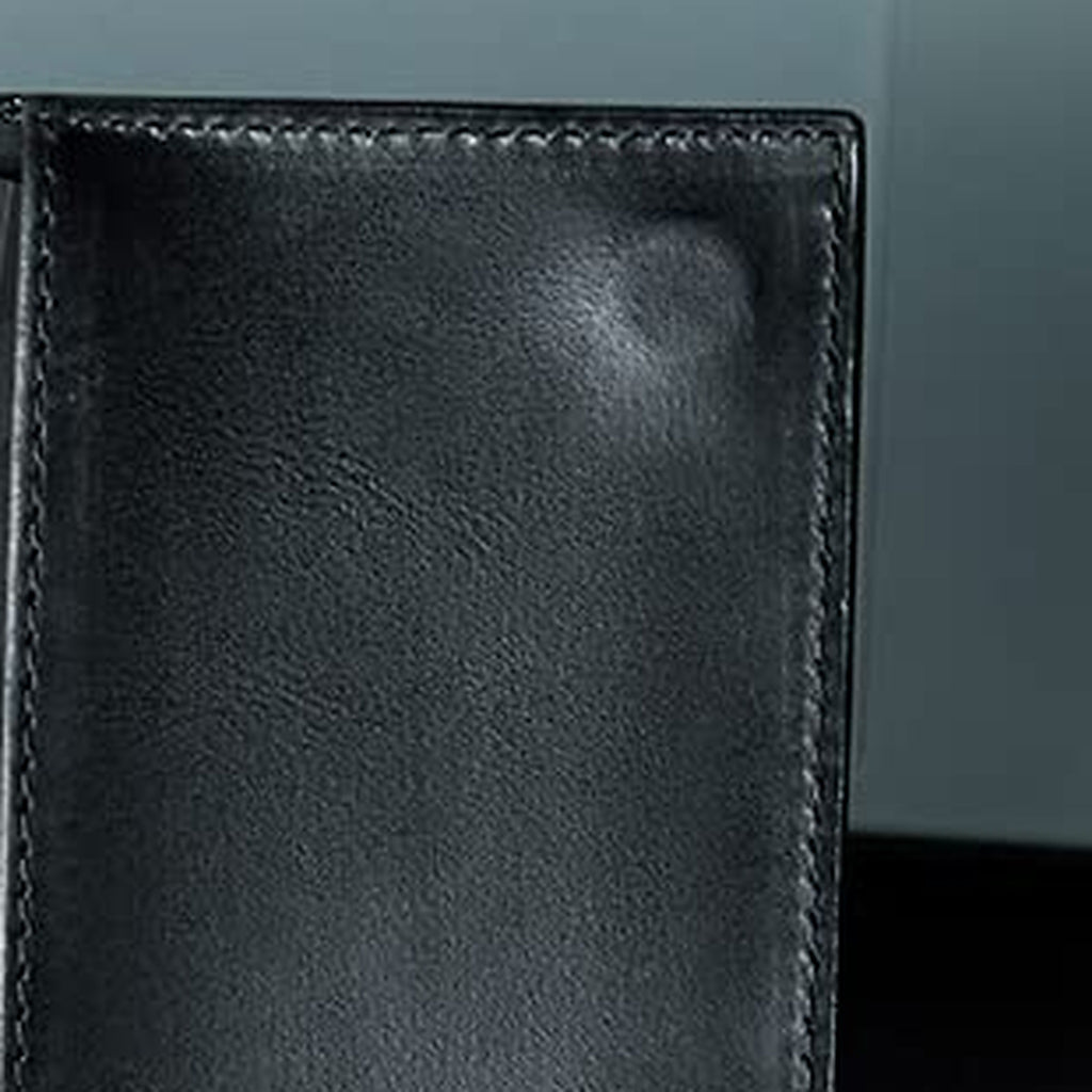 Inside panel of the slim black wallet, showing the stitched edge